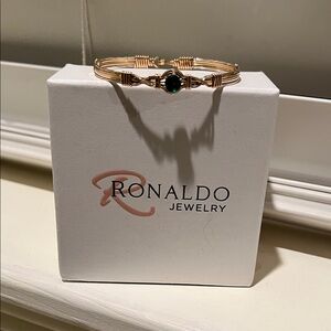 Ronaldo Two-tone bracelet with green stone.  Fits up to 71/2 “ wrist.